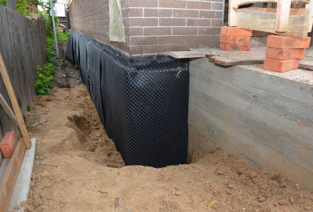 Happy homeowners after waterproofing job in Knoxville